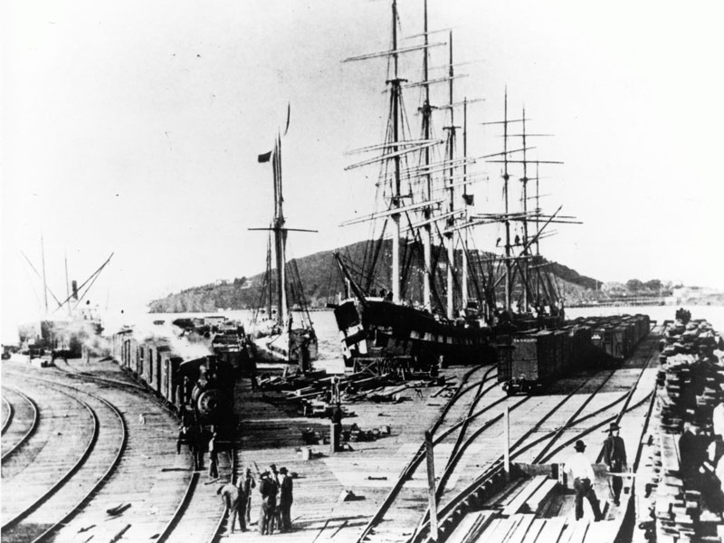 Oakland Long Wharf at the turn of the century, looking west to Yerba Buena Island. 